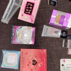 Assorted make up pieces from various brands.